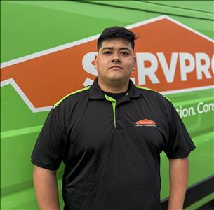 man in front of green background