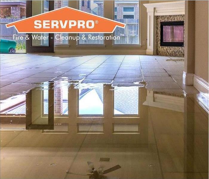 water damage in house with SERVPRO logo